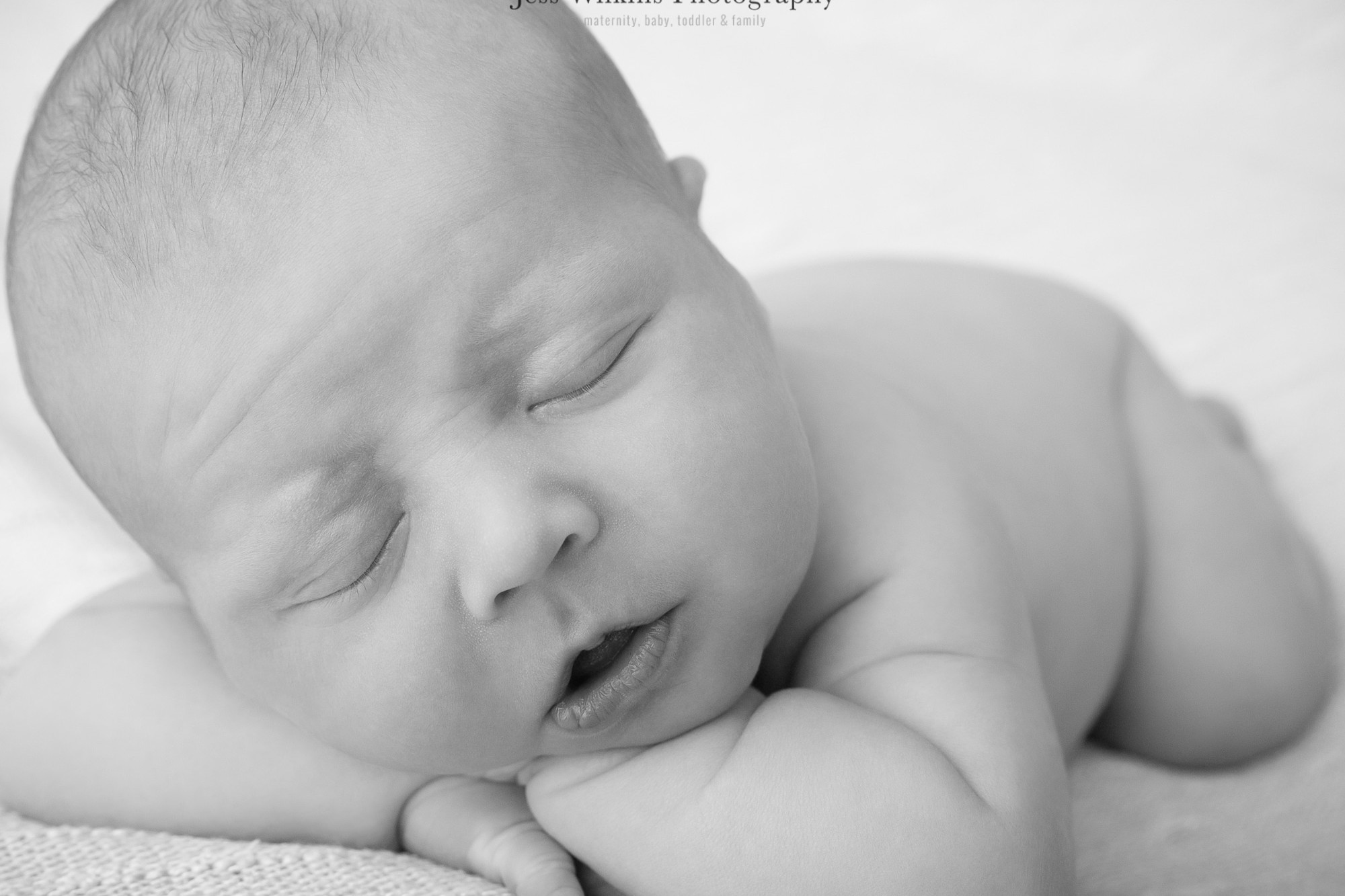 sleepy newborn black and white